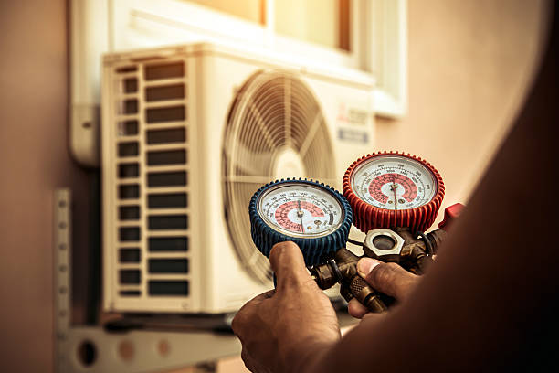 Professional Heat Pump Repair technician working in Pierron, IL